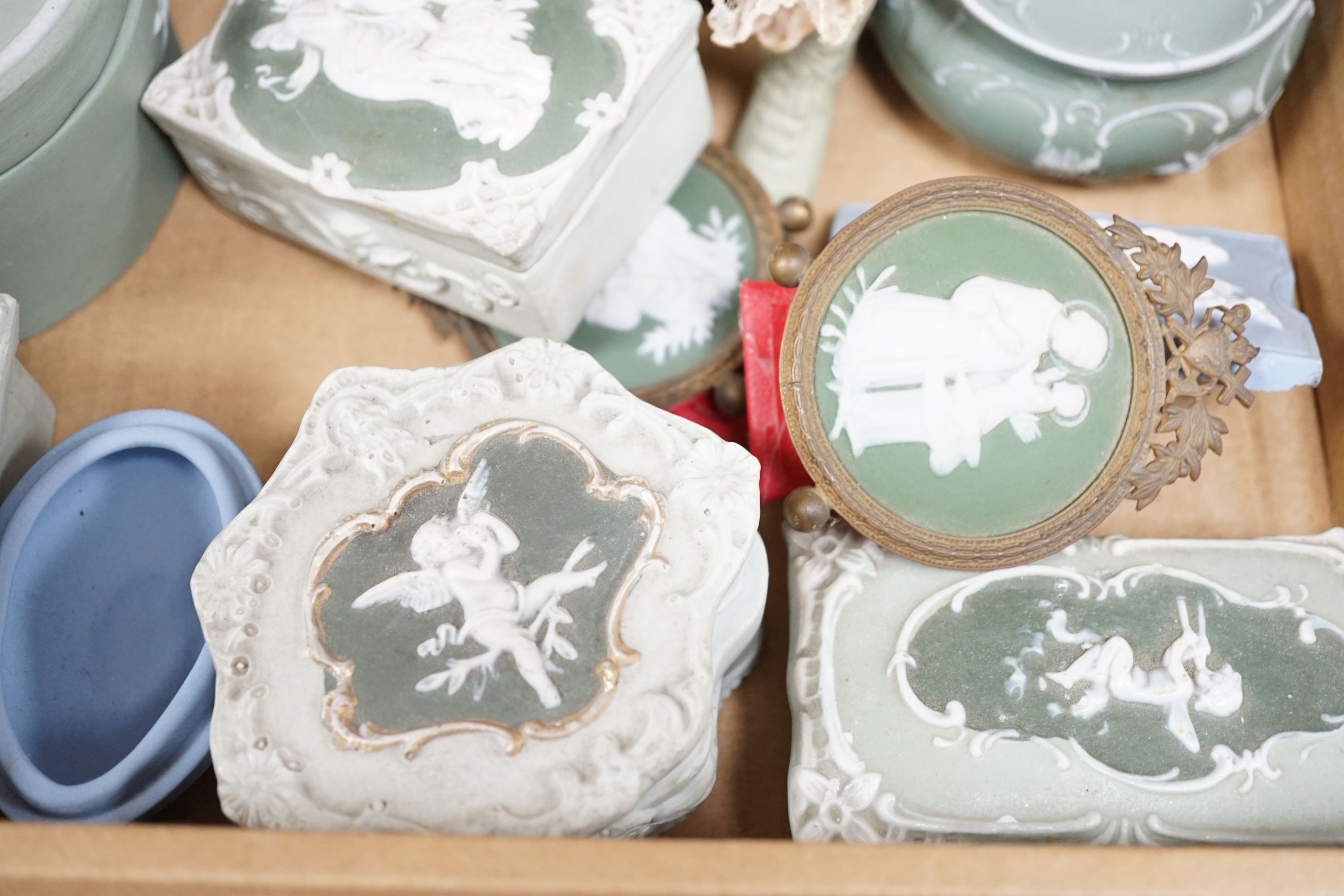 A collection of French bisque boxes and vases.